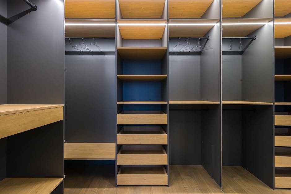 Expansive modern custom closet featuring dark wood finishes